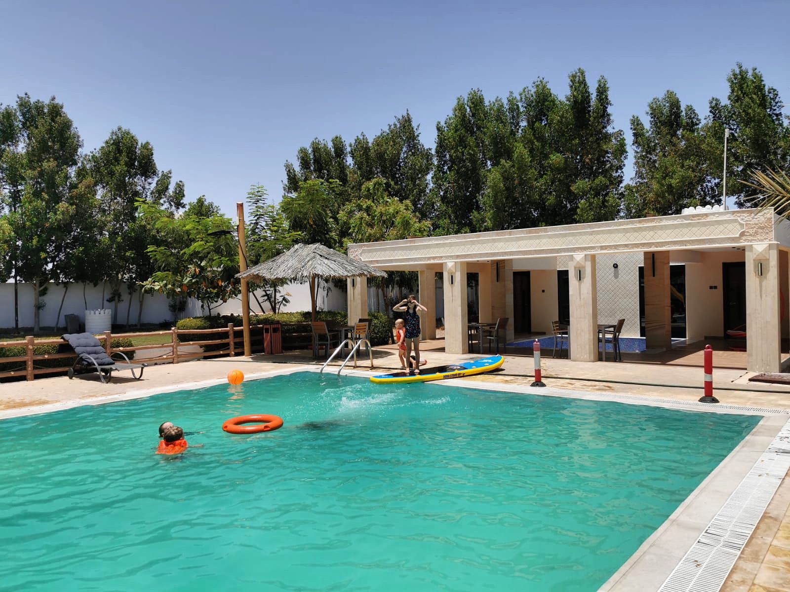 Pool and shaded terrace at Citi Farm Resort